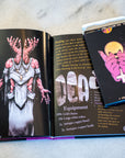 Pilgrimage of the Penitent RPG Bundle – Hardcover Book, Reference Card Deck & Enamel Pin