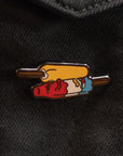 Colorful pin on a black denim jacket