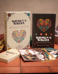 Two books titled 'Women's Week' on a tiled surface with decorative elements.