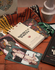 Collection of books and cards on a textured surface