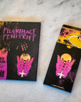 Pilgrimage of the Penitent RPG Bundle – Hardcover Book, Reference Card Deck & Enamel Pin