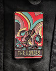 Colorful 'The Lovers' pin on a black jacket