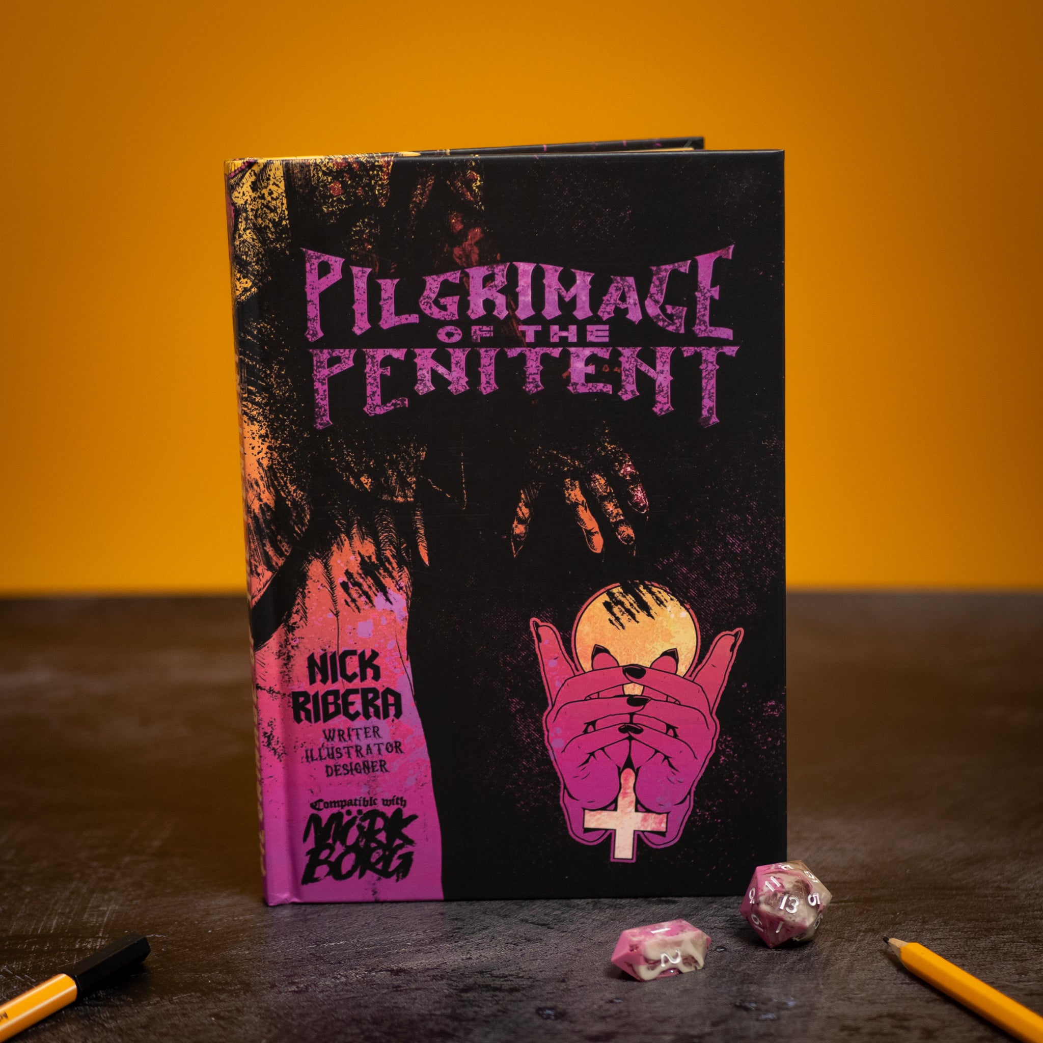 Book titled 'Pilgrimage of the Penitent' with a dark cover and pink text on a yellow background