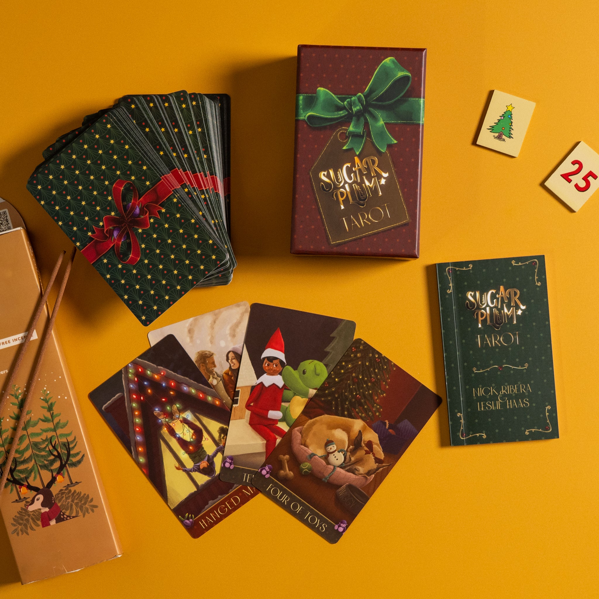 Sugar Plum Tarot cards and packaging on a yellow background
