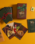Sugar Plum Tarot cards and packaging on a yellow background