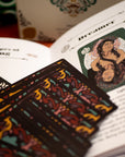 Card deck with colorful designs on a book