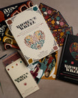 Collection of 'Women's Wheel' books and materials on a textured surface